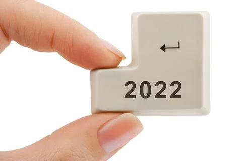 Computer button 2022 in hand Stock Photos
