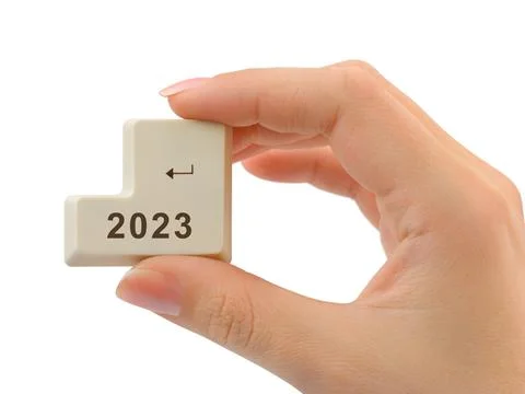 Computer button 2023 in hand Stock Photos