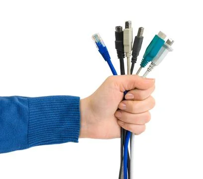 Computer cables in hand Computer cables in hand isolated on white backgrou... Stock Photos