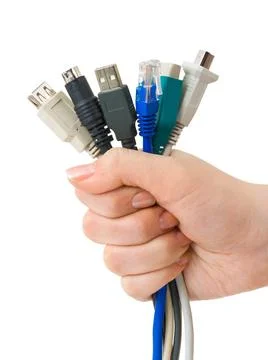 Computer cables in hand Computer cables in hand isolated on white backgrou... Stock Photos