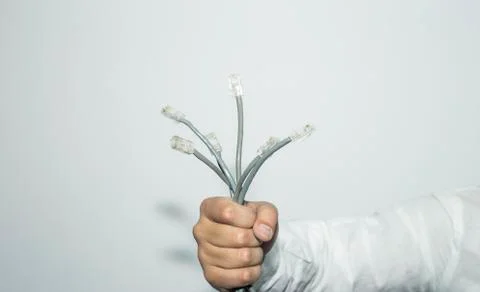 Computer cables in hand on white background. Foto stock
