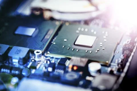 Computer chip on a circuit board, close up with light effect. Computer Foto stock