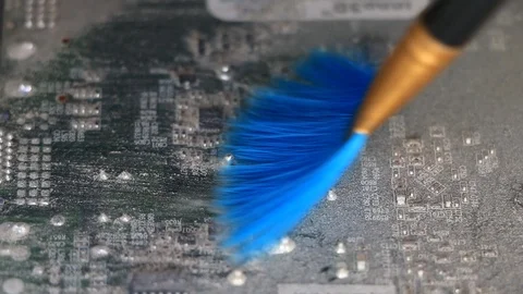 Computer chip cleaning with a brush Stock-Footage 111926249