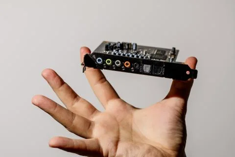 Computer chip in a hand over white Stock-Fotos