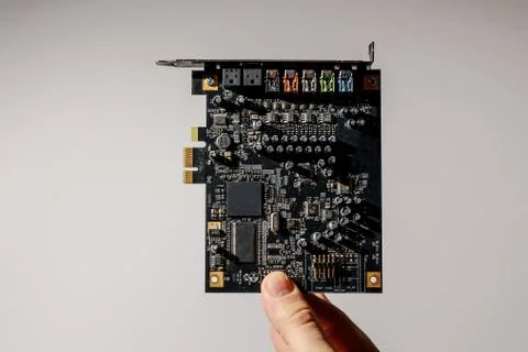 Computer chip in a hand over white Foto stock