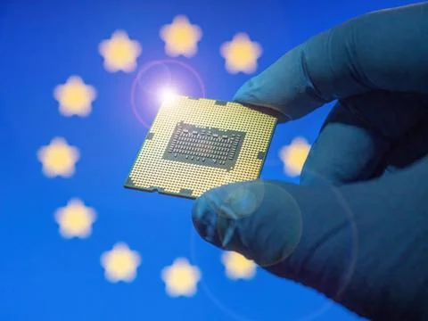 Computer chip microprocessor in the lab glove against EU Flag as ideas conc.. 写真素材