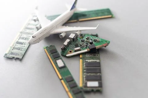Computer chips and a toy airplane 库存照片
