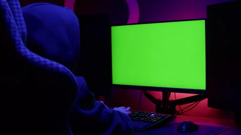 Computer with chroma key green screen on monitor. Gamer man playing in popular Stock Footage 269453172