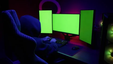 Computer with chroma key green screen on monitor. Gamer man playing in popular Stock Footage 269579424