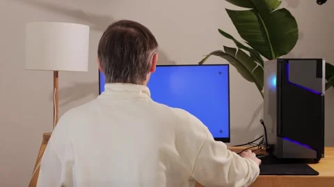 Computer with chroma key green screen on monitor. Gamer man playing in popular Stock Footage 270099151