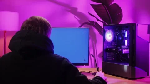 Computer with chroma key green screen on monitor. Gamer man playing in popular Stock Footage 272477896