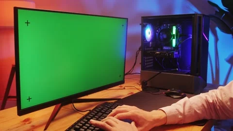 Computer with chroma key green screen on monitor. Gamer man playing in popular Stock Footage 274320384