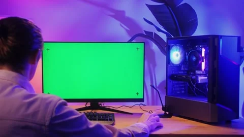 Computer with chroma key green screen on monitor. Gamer man playing in popular Stock Footage 280586487