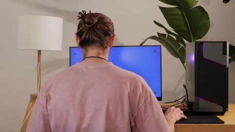 Computer with chroma key green screen on monitor. Gamer man playing in popular Stock Footage 285547889