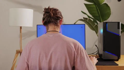 Computer with chroma key green screen on monitor. Gamer man playing in popular Stock Footage 285548210