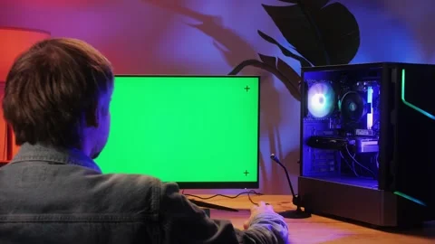 Computer with chroma key green screen on monitor. Gamer man playing in popular Stock Footage 285548511
