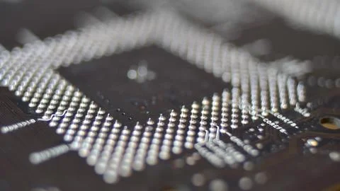 Computer Circuit Board with Electronic Chips Rotating Close Up 写真素材