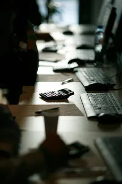 Computer class, exam, backlight in a dark manner, close-up Stock Photos