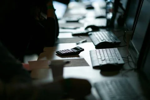Computer class, exam, backlight in a dark manner, close-up Stock Photos