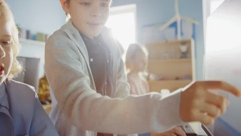 Computer Classroom: Portrait of Smart Girl and Boy Talking while using PC 스톡 동영상 119360672