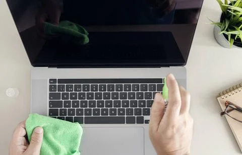 Computer cleaning concept. Top view of a male human hands cleaning a lapto... Foto stock