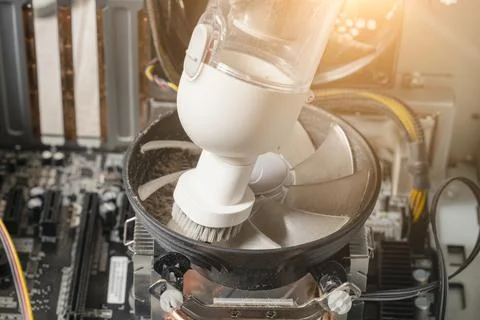 Computer cleaning with a small vacuum cleaner, computer maintenance Stock Photos