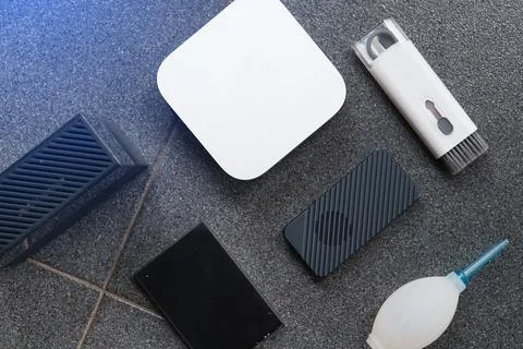 Computer cleaning tools and accessories on a dark surface. Technology maint.. 库存照片