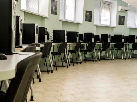 Computer Club, computer class with many PC, tables and chairs Stock Photos