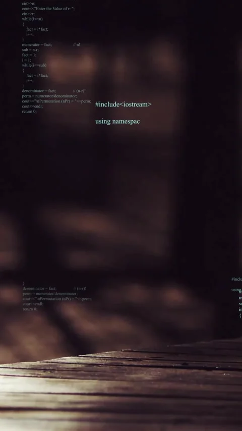 Computer code animation over blurred wooden table and dark background Stock Footage 319883055