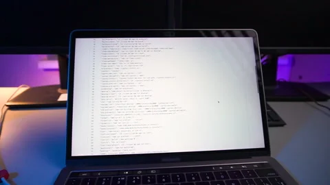 Computer code running over screen of laptop Stock Footage 161256018