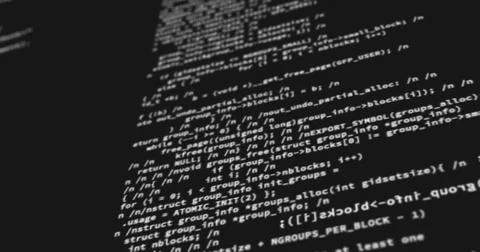 Computer codes projected on the screen while being written or typed Stock Photos