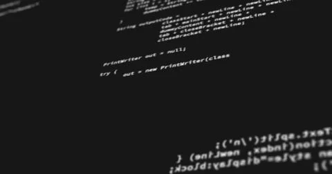 Computer codes projected on the screen while being written or typed Stock Photos