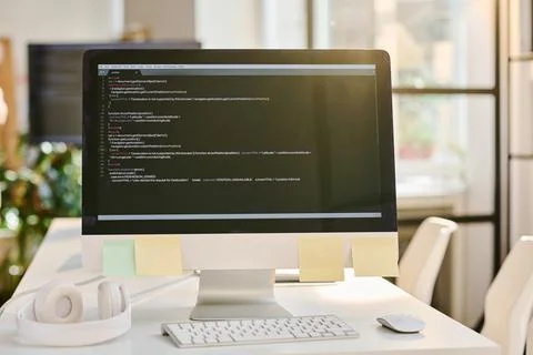 Computer with codes on the screen Foto stock