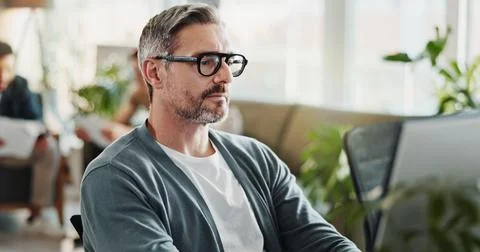 Computer, concentration and web development with man in creative workplace for 写真素材