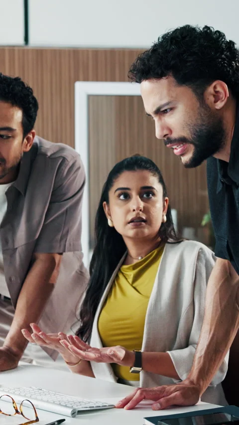 Computer, conflict and talking with business people in office together for Stock Footage 331581060