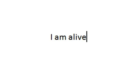 Computer console typing 'i am alive' in digitized font Stock Footage 43930286