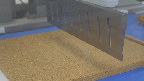 A computer controlled cutter slices cakes to the correct size for Video stock 132167396
