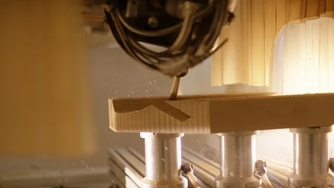 Computer controlled milling machine precisely shaping a piece of wood. Video stock 119034965