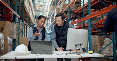 Computer, conversation and logistics with people in warehouse for distribution Stock Footage 335935854