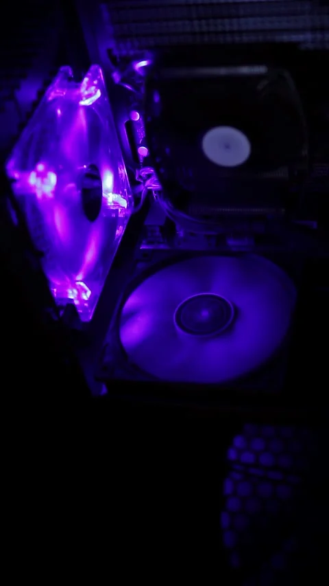 Computer coolers with blue backlight. Fans Are Spinning Inside Computer. Stock Footage 268384661