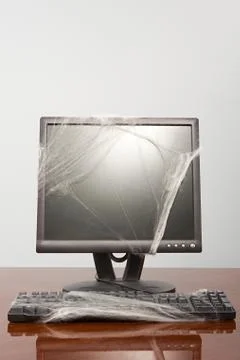 Computer covered in cobweb Stock Photos