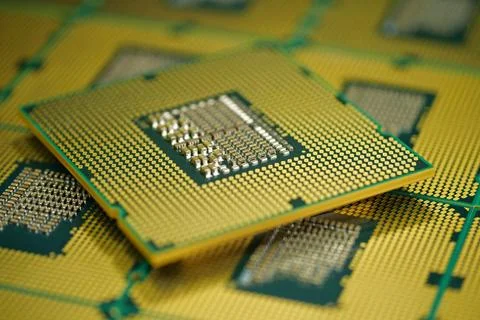 Computer CPU close up highlighting pin grid array structure on the chip Stock Photos