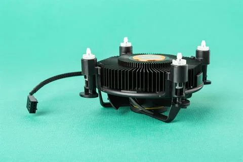 Computer CPU cooling fan radiator upside down on a turquoise background. Stock Photos