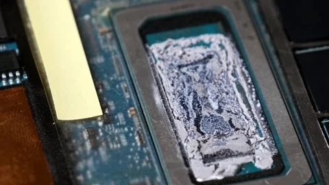 Computer CPU with Dried Thermal Paste on a Motherboard Stock Footage 313861060