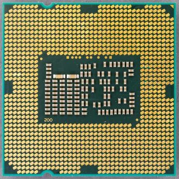 Computer cpu processor microchip pins connecting to motherboard Stock Photos