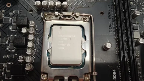 Computer CPU socket and processor installed on a motherboard Stock Footage 348227389