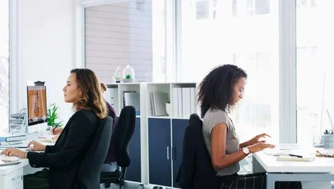 Computer, creative and typing with designer women in workplace for development Stock Photos
