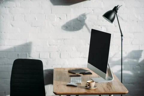 Computer cup wooden table office Stock Photos
