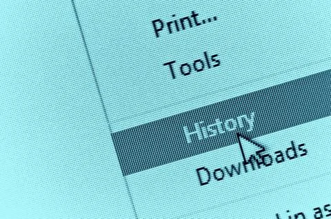 Computer cursor pointing to internet browser history in drop down menu Stockfoto's