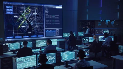 Computer Data Science Engineers Work in Control and Monitoring Room Stock Footage 135925376
